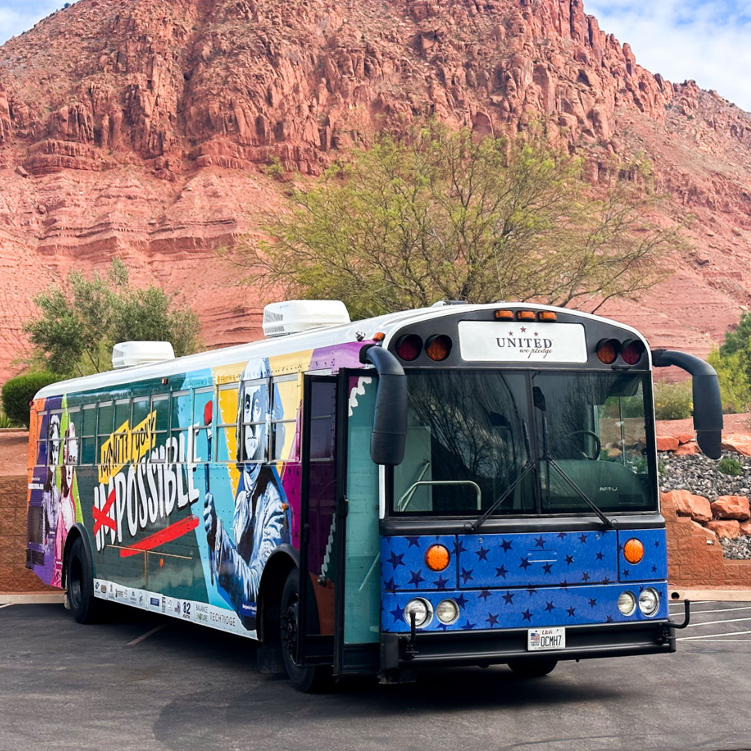 Liberty Bus in front of mesa in St. George, UT