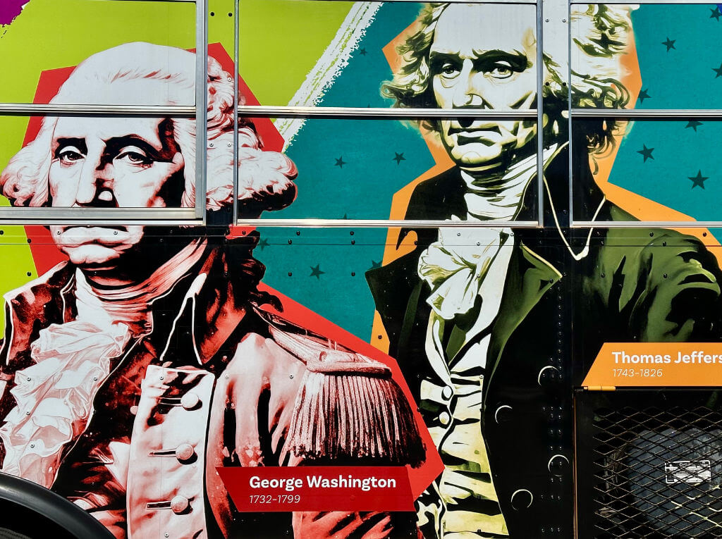 graphics of george washington and thomas jefferson on united we pledge liberty bus